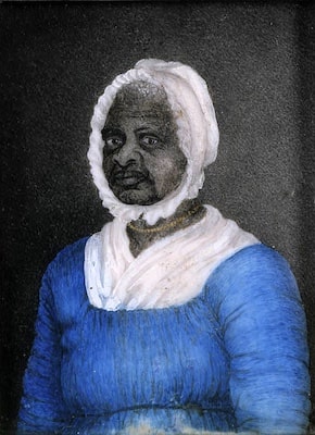 The painting shows an elderly Black woman with a white bonnet and a blue dress in the style of the early 1800s. She has a serious, piercing gaze.
Artist: Susan Anne Ridley Sedgwick (1788–1867). c. 1812. Photo courtesy of Massachusetts Historical Society, Boston. Public domain via Wikimedia Commons.